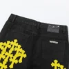 Vaqueros amarillos desgastados de Chrome Hearts